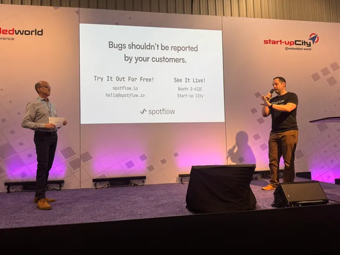 Spotflow CEO Jan Kucera pitching on stage at Embedded World 2026.